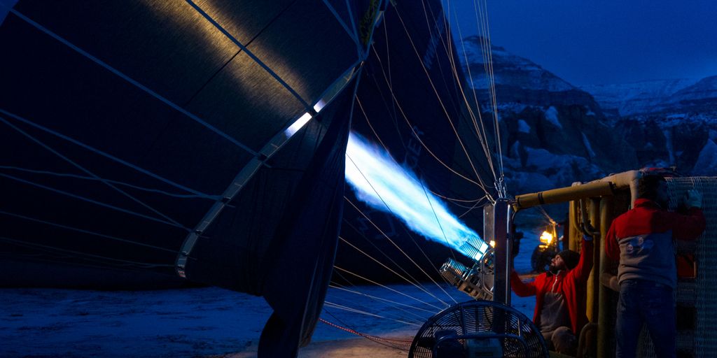 two men fixing hot air balloon